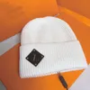 Höst vinter tryckt stickad hatt designer solid färg ull hattar utomhus varm tjocka sport beanie män kvinnor par skalle kepsar