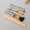 Anime Demon Slayer ensemble de pinceaux de maquillage 5 pièces pinceaux de dessin animé pour fond de teint poudre ombre à paupières pinceau à lèvres cosmétique Cosplay cadeau outil de maquillage avec sac de rangement