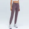 L-31 Kvinnor Yoga Pants Slim var tunna yogabyxor med fickor Sport fitnessbyxor utomhus mode dam lös rak jogger outf3040