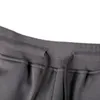 2021FW Otoño e invierno Pantalones de hombre Versátiles Pantalones de ocio Calle exterior Felpa Herramientas Pantalones de chándal Insignia bordada Tendencias europeas americanas