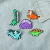 Dinosaur with books Brooch Pins Enamel Animal Lapel Pin for Women Men Top Dress Cosage Fashion Jewelry Will and Sandy