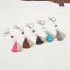 Foreign trade carved beaded wooden bead keychain personality two-color cotton tassel pendant key ring wholesale multi-color optional