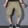 Pantaloni corti cargo estivi da uomo 3/4 di lunghezza Pantaloni larghi dritti Baggy s Boardshort maschio Hip Hop Plus Size 5XL 210713