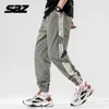 Saz 2021 Primavera Outono Calças Pretas Calças Mens Mens Moda Baggy Hip Hop Cargo Harem Pant Rua Desgaste Homem Clothing X0723