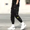 Hip-Hop Street Jogger Sports الرجال الأسود الحريم السراويل متعددة جيب الشريط عارضة M-3XL 210715