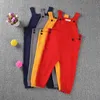 Pojke knit vårbarn barn godis bib harem byxor pojkar flickor pocket stickade overalls jumpsuits baby kläder 210417