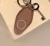 Lettre de mode haute qualité porte-clés femme hommes argent boucle porte-clés à la main en cuir PU porte-clés voiture sac à main clés chaîne Couple 277V