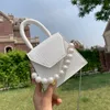 HBP White Oeak Pearl Handle Super Mini Bag Design Borse a tracolla in pelle PU per donna 2021 Borse a tracolla con motivo a pietra Borse da viaggio piccole da donna