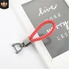High-quality creative hand-woven leather cord Car braided key ring pendant metal horseshoe buckle small gift