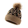 Зимние женщины теплые шляпы вязаные леопардовые печатные крышки скрученные шерстяные мяч на открытом воздухе