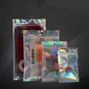 100pcs / lot Sacs d'emballage transparents + holographiques à fermeture à glissière avec porte-cintre en haut Pochettes d'emballage d'accessoires pour téléphone multi-tailles transparentes sur le devant