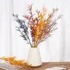 konstgjorda blommor för lång vas