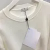 50% de descuento Diseñador de moda Sudaderas con capucha Camisa de punto Otoño Invierno Suéter de mujer con decoración de perlas Negro Blanco 2 colores S-L 98310