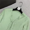 Kvinnors stickor Kvinnors tees 2022 Rhinestone Button Sweet Lace V-Neck Green Long Sleeve Polka Dot tröja 0309