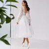 Tea Längd V-Neck Bröllopsklänningar 2021 Lantern Långärmad Bride Dress Ivory Lace Illusion Button Back Boho Beach Short Bridal Gowns for Women
