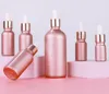 アイドロッパーゴールドキャップピンクのエッセンシャル油詰め替え可能化粧品容器とガラス試薬ピペットボトル