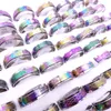 Wholesae 100pcs lote de aço inoxidável spin rings rings rotatáveis ​​multicolor laser Mix Patterns Moda