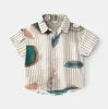 طفلة ملابس الصيف قصيرة الأكمام قمصان الكرتون نمط شاطئ قميص زر بدوره أسفل الياقة عارضة قمم 4 ألوان