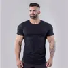 Brand Men's Muscle Fitness Short Sleeve T-shirts Cotton Gyms Tshirt Solid Arc hem Tops Breathable Stretch Tee shirts 210421
