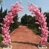 Décoration de mariage romantique porte en arc de fleurs de cerisier route plomb étagère en forme d'arches en forme de lune avec ensemble de fleurs artificielles pour fournitures de toile de fond de fête