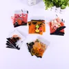 Joyeux Halloween sac de bonbons 100 pièces/lot cuisson Cookie Wraps citrouille sorcière impression auto-adhésif en plastique Biscuits Snack friandises emballage sacs translucide cadeau TH0093