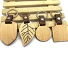 Porte-clés en bois et cuir PU pour femmes et hommes, à la mode, personnalisé, pendentif de sac, accessoires de bijoux, vente en gros