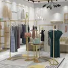 衣料品店鉄服ラック商業家具モダンなシンプルゴールド女性の布フロアディスプレイラックショッピングモールショープラットフォーム