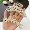 Pearl rhinestone metal clamps ladies peacock tail fish bone shape large hair claw new temperament headdress