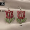 Lampadario penzolante Orecchini pendenti con strass colorati eleganti per le donne Gioielli da festa alla moda in lega di geometria con fiori cavi irregolari alla moda