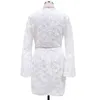Foridol Branco Laço Envoltório Curto Dress Sheer Hollow Out Flare Manga Longa Embrióderia Praty Dress Elegante Senhoras Curto Vestido Vestido 210415