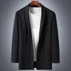 Męskie swetry wiosna jesień koreański moda czarny dziergany kardigan płaszcz bez guzika męskie ubrania Plus rozmiar 6XL 7XL 8XL