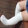 靴下赤ちゃん女の子男の子の制服ニーハイチューブフリルストッキングユニセックス長い愛らしい靴下幼児のための幼児冬の足の暖かい