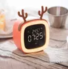 The latest desk clocks, cute pet cartoon TV children's snooze LED electronic clock USB charging student lazy clock