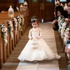 2021 Adorável flor meninas vestidos para casamentos princesa jóia longa mangas Lace Appliques Big Bow Sweep Train Little Kids Sagry Pageant Dress