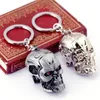 مفاتيح مفاتيح HF 12pcs/Lot Movie Terminator keychain 3d skull metal head شكل شعار سلسلة مفاتيح الحامل حلقة قلادة قلادة chaveiro