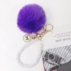 Fausse fourrure Pompom Keychain Bowknot Badge Pearl Key Chains For Women Bag Car Bijoux Coupages Coupages Contrôle Honaire Clé
