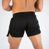 Muscleguys New Summer Mens Gyms Shorts Fitness Mode Casual Joggers Entraînement Bodybuilding Mesh Short de plage à séchage rapide 210421