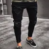Мужские черные разорванные джинсы вымыты