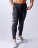 秋のメンズスポーツファッションパンツトレーニングフィットネスランニング通気性のあるズボンカジュアルとタイトなスウェットパンツ2757