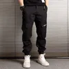 Moda Streetwear Jeans da uomo Loose Fit Pantaloni cargo mimetici casual Pantaloni Harem Pantaloni da jogging Hip Hop con tasche grandi210H