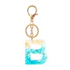 Cristal fait à la main époxy feuille d'or porte-clés mots anglais lettres porte-clés paillettes clé pendentif sac breloques porte-clés cadeaux d'anniversaire