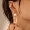 Boucles d'oreilles pendantes lustre en métal rouge perles de forme irrégulière géométrique créative insolite oreille manchettes boucle d'oreille femme européenne