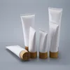 Nyemokvitt vit plastpressonflaska Kosmetisk krämburkar Refillable Travel Lip Balm Container med bambu keps RRD12851