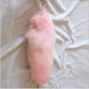 Kvinnor Real Fox Fur Tail Keychain Bag Tassel Tag Charm Handväska Hängsmycke Kvinna Stor Ryggsäck Tillbehör Key Ring Hela pris