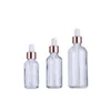 Wholesale clear serum glass dropper bottles 5ml 10ml 15ml 20ml 30ml 50ml 100ml with rose gold lid for essential oils