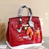 Designers htote väskor mode handväskor 2024 handdesigner Berkins kvinnor platina kapacitet bärbar en axel 30 cm jiru