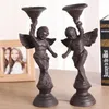 Titulares de vela Ferro de ferro forjado Suporte Europeu Angel Antique Retro Retro Decoração Decoração Mesa Centerpieces Kandelaar Acessórios da Sala AH50CH