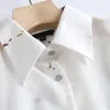Blusas das mulheres Camiseta MD 2021 Moda Simples Colar para baixo Printing Botão Frontado Blusa Feminina Inglaterra Estilo Casual Camisa Lisa