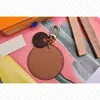 Luxury design M69317 Flower REVERSE KEY HOLDER BAG CHARM Designer Accessory Keyholder Keyring Car Key Bell Keychain ID Name Tag Holder Hot Stamping Stamp