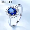 anillo de compromiso de plata con zafiro azul plata
